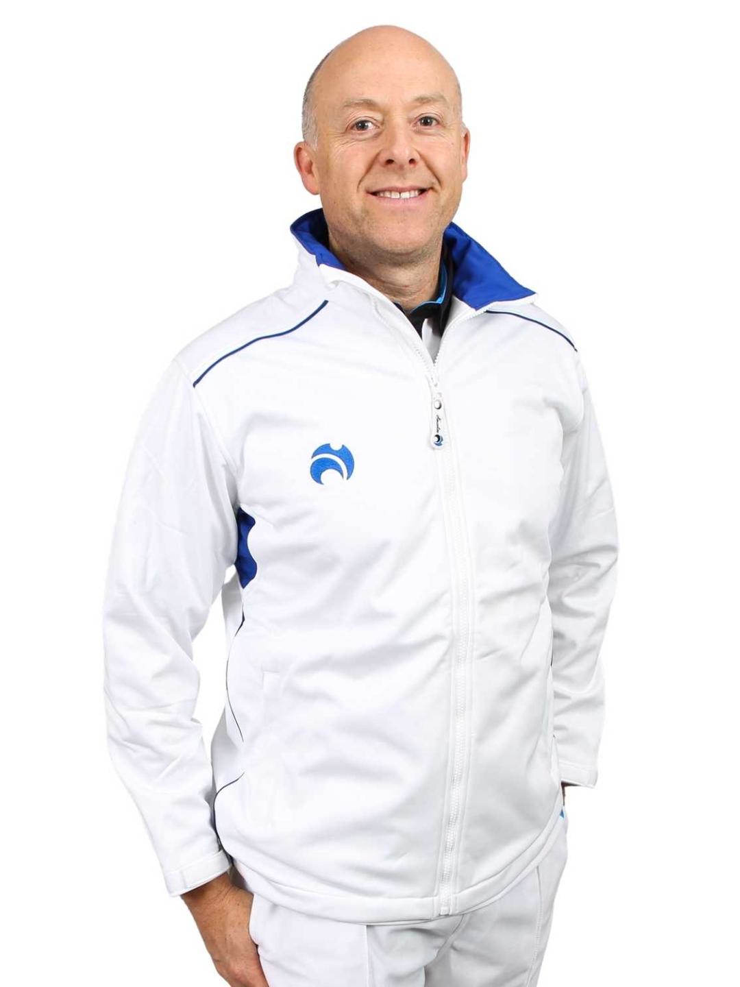 Man wearing a white jacket with a blue logo on a white background